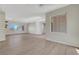 Bright living room with hardwood flooring, large windows, and neutral paint at 2039 Colvin Run Dr, Henderson, NV 89052