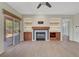 Cozy living room features a fireplace, built-in shelving, and access to the patio at 2039 Colvin Run Dr, Henderson, NV 89052