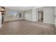 Spacious living room with wood floors, large window with views, and open floor plan at 2039 Colvin Run Dr, Henderson, NV 89052