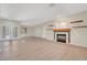 Bright living room with wood floors, fireplace, open shelving, recessed lights and glass panel doors at 2039 Colvin Run Dr, Henderson, NV 89052