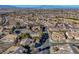 Aerial view of a residential neighborhood with desert landscaping and mountain views at 2039 Colvin Run Dr, Henderson, NV 89052