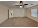 Spacious bedroom featuring neutral walls, carpet flooring, and ample natural light at 209 Copper Pine Ave, North Las Vegas, NV 89031