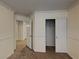 Neutral bedroom with a closet, neutral walls, and carpet flooring at 209 Copper Pine Ave, North Las Vegas, NV 89031