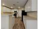 Spacious kitchen featuring white cabinets, stainless steel appliances, and ample counter space at 209 Copper Pine Ave, North Las Vegas, NV 89031