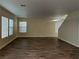 Large, open living room with wood-look flooring and plenty of natural light at 209 Copper Pine Ave, North Las Vegas, NV 89031