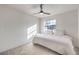 Neutral bedroom features a comfortable bed, carpet flooring, and a window with natural light at 210 E Longacres Dr, Henderson, NV 89015