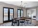 Charming dining area with natural light, a stylish chandelier, and comfortable seating at 210 E Longacres Dr, Henderson, NV 89015