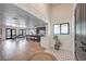 Inviting home foyer showcases stylish tile flooring, an open floor plan, and views into the dining and kitchen areas at 210 E Longacres Dr, Henderson, NV 89015