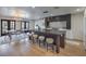 Spacious kitchen boasts a large center island, modern lighting, and stainless steel appliances at 210 E Longacres Dr, Henderson, NV 89015