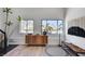 Bright living room with wood floors, lots of light, and nice decor at 210 E Longacres Dr, Henderson, NV 89015