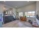 Bright entry way with wood floors, lots of light, black stairs, and nice decor at 210 E Longacres Dr, Henderson, NV 89015