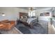 This main bedroom features a ceiling fan and sitting area at 210 E Longacres Dr, Henderson, NV 89015