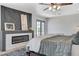 This main bedroom features a fireplace, ceiling fan, and private access to the outdoors at 210 E Longacres Dr, Henderson, NV 89015