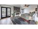 This main bedroom features a fireplace, ceiling fan, and private access to the outdoors at 210 E Longacres Dr, Henderson, NV 89015
