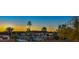 Sunset view showing palm trees with city and mountain views in the background at 210 E Longacres Dr, Henderson, NV 89015