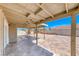 Backyard patio with ample space, featuring both concrete and brick-paved areas, with palm trees at 2103 Falcon Crest Ave, North Las Vegas, NV 89031