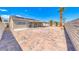 Large backyard with full brick pavers, providing an expansive outdoor space for activities at 2103 Falcon Crest Ave, North Las Vegas, NV 89031