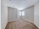 Neutral bedroom with new carpeting and a bright window at 2103 Falcon Crest Ave, North Las Vegas, NV 89031