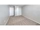 Neutral bedroom showcasing clean finishes, plush carpeting, and a built-in wardrobe for ample storage at 2103 Falcon Crest Ave, North Las Vegas, NV 89031