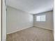 Bedroom with neutral carpeting and a window at 2103 Falcon Crest Ave, North Las Vegas, NV 89031