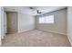 Bedroom with ceiling fan and large window at 2103 Falcon Crest Ave, North Las Vegas, NV 89031