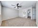 Bedroom with ceiling fan and adjoining rooms - bathroom and closet at 2103 Falcon Crest Ave, North Las Vegas, NV 89031
