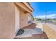 Charming front entrance with welcoming mat and sidewalk leading up to the door at 2103 Falcon Crest Ave, North Las Vegas, NV 89031