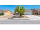 Charming single-story home with xeriscaped front yard and well-maintained curb appeal at 2103 Falcon Crest Ave, North Las Vegas, NV 89031