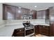 Kitchen with stainless steel appliances and white tile countertops at 2103 Falcon Crest Ave, North Las Vegas, NV 89031