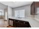 Kitchen sink with stainless steel appliances and white tile backsplash at 2103 Falcon Crest Ave, North Las Vegas, NV 89031