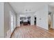 Open floor plan with wood floors leading to the kitchen and a door to the outside at 2103 Falcon Crest Ave, North Las Vegas, NV 89031