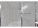 Modern bathroom with tiled shower and glass door at 2325 Windmill Pkwy # 1023, Henderson, NV 89074