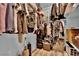 Spacious walk-in closet with ample storage shelves and rods at 2325 Windmill Pkwy # 1023, Henderson, NV 89074