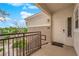 Charming front entrance of a home with cozy porch, wrought-iron railings, and landscaped walkway at 2325 Windmill Pkwy # 1023, Henderson, NV 89074