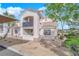 Well-maintained two-story home featuring a charming balcony, neutral tones, and meticulously landscaped grounds at 2325 Windmill Pkwy # 1023, Henderson, NV 89074