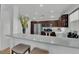 Bright open concept kitchen features an island with seating, modern appliances, and ample cabinet space at 2325 Windmill Pkwy # 1023, Henderson, NV 89074