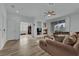 Bright open concept living room features fireplace, hardwood floors, and sliding glass doors to backyard at 2325 Windmill Pkwy # 1023, Henderson, NV 89074