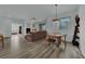 Bright open-concept living room featuring lots of natural light and hardwood flooring at 2325 Windmill Pkwy # 1023, Henderson, NV 89074