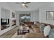Cozy living room with fireplace, hardwood floors, and sliding glass doors to backyard at 2325 Windmill Pkwy # 1023, Henderson, NV 89074