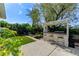 Outdoor bar area with seating, grill, and lush landscaping creating a tropical paradise at 2345 Villandry Ct, Henderson, NV 89074
