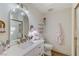 Bright bathroom featuring a modern vanity, and an arched mirror at 2345 Villandry Ct, Henderson, NV 89074
