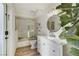 Modern bathroom with a glass shower, bright vanity, and ample storage at 2345 Villandry Ct, Henderson, NV 89074