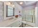 Updated bathroom featuring a vanity, framed mirror, and combination tub and shower at 2345 Villandry Ct, Henderson, NV 89074