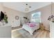 Bright bedroom with a large window, a comfortable bed, and modern decor at 2345 Villandry Ct, Henderson, NV 89074