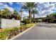 Community entrance featuring 'The Fountains' signage, lush landscaping, and a secure entry gate at 2345 Villandry Ct, Henderson, NV 89074