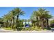 Gorgeous community entrance with mature palm trees and striking fountain for a luxurious welcome at 2345 Villandry Ct, Henderson, NV 89074