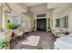 Inviting front porch with a double door entry, decorative pillars, and ample seating at 2345 Villandry Ct, Henderson, NV 89074