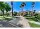 Stunning single-story home with meticulous landscaping, mature trees, and a spacious driveway at 2345 Villandry Ct, Henderson, NV 89074