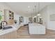 A modern kitchen features stainless steel appliances, a large island, and bright, open floor plan at 2345 Villandry Ct, Henderson, NV 89074
