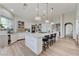 Bright kitchen featuring a large center island, modern pendant lights, and high-end appliances at 2345 Villandry Ct, Henderson, NV 89074